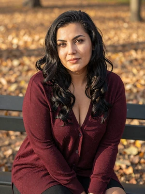 Elena, 31-year-old Romanian woman from Timișoara with long black hair and caring expression